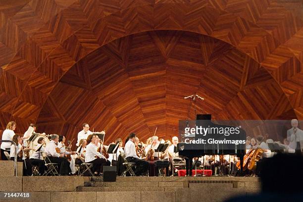 group of musicians on stage, boston, massachusetts, usa - orchestra stock-fotos und bilder