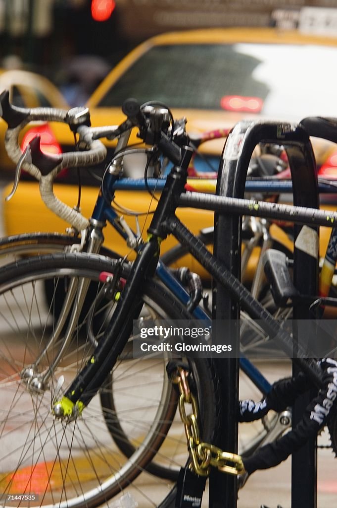 Close-up of bicycles parked at a bike rack, Chicago, Illinois, USA