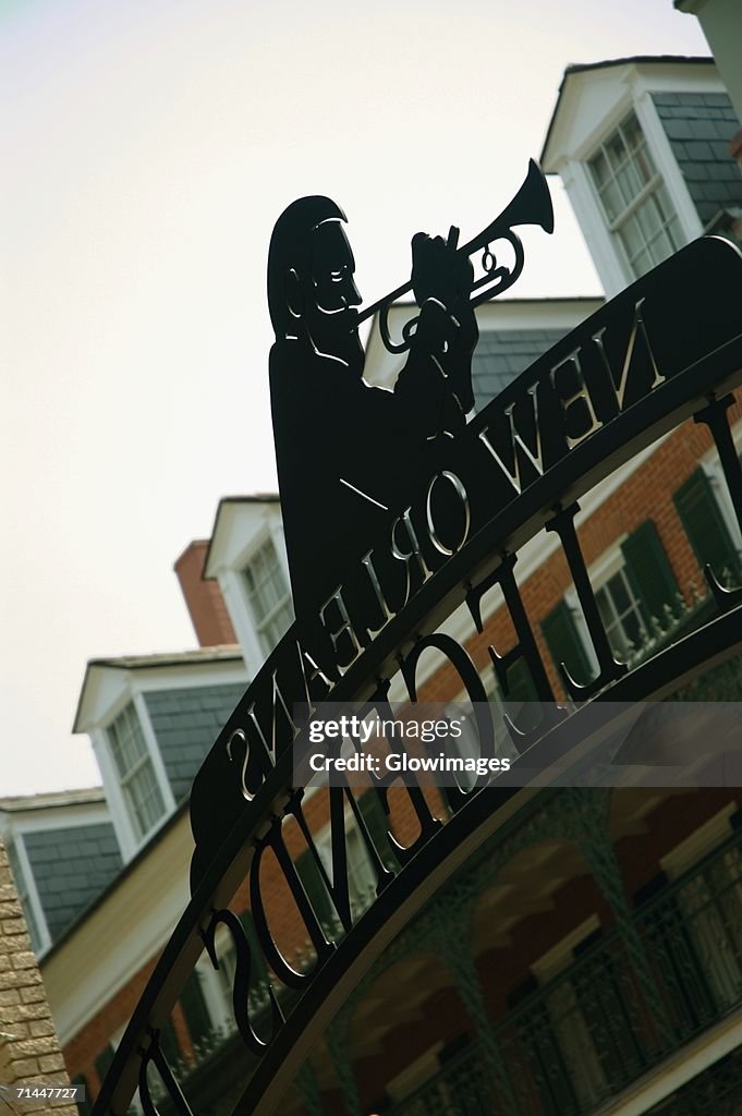 Low angle view of the statue of a man playing the trumpet, New Orleans, Louisiana, USA