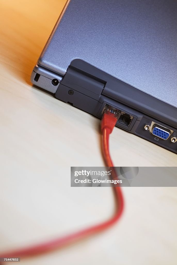 Computer With Cable Plugged In Closeup Of A Network Cable Plugged Into A Laptop High-Res Stock Photo ...