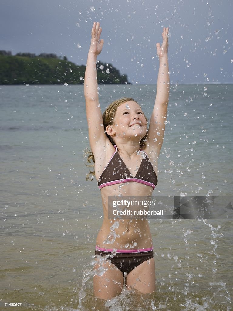 Close-up of a girl splashing water