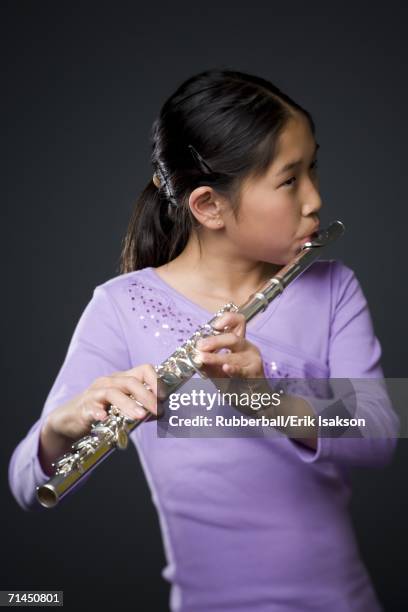 close-up of a girl playing the flute - lip plate stock pictures, royalty-free photos & images