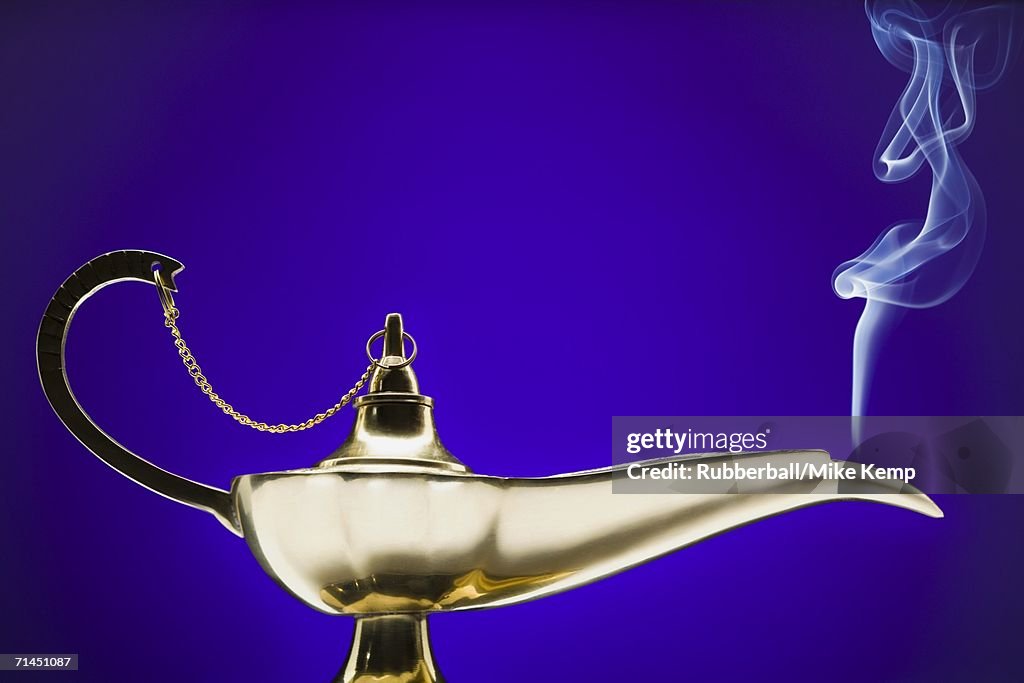 Close-up of a magic lamp emitting smoke