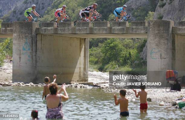 Ukraine's Andriy Grivko rides in front of Germany's Jens Voigt , Spain's Oscar Pereiro Sio , France's Sylvain Chavanel , and Italy's Manuel Quinziato...