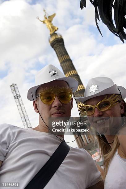 Participants attend the 16th annual Loveparade weekend July 15, 2006 in Berlin, Germany. Over 300 DJs on 39 trucks, so called "floats" turn the...