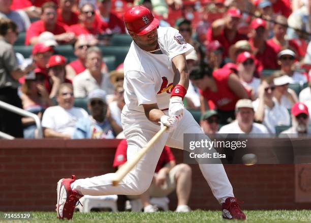 Albert Pujols of the St. Louis Cardinals hits a solo home run against the Los Angeles Dodgers on July 15, 2006 at Busch Stadium in St. Louis,...