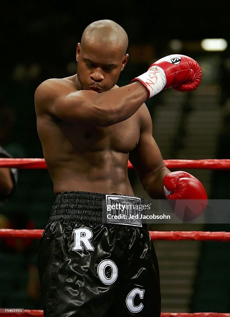 Rockell Allen Rock Allen kisses his bicep muscle before his junior welterweight ...