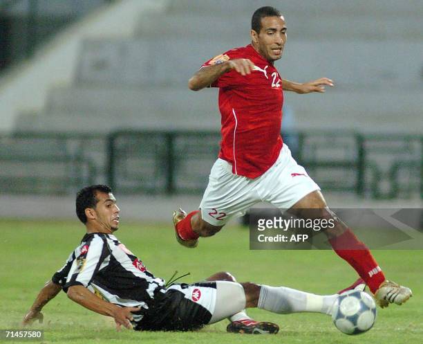 Egyptian striker Ahly Du Cairo Mohamed Chawki vies with Tunisian CS Sfaxien's Aiemen Ben Amor during their African Champions League Group B third...