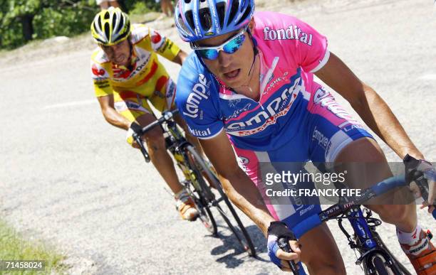 Italy's Damiano Cunego followed by Spain's Ruben Lobato breaks away from the pack during the 180.5 km fourteenth stage of the 93rd Tour de France...