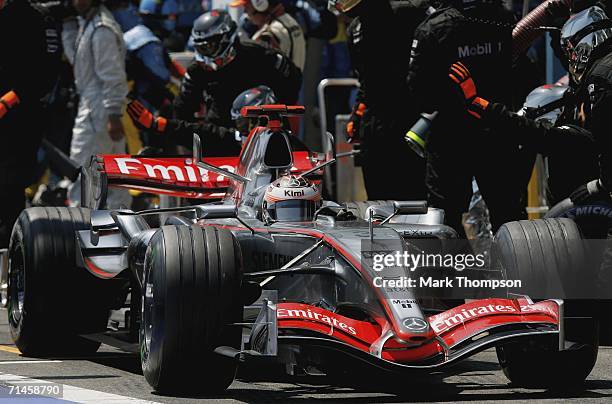 Kimi Raikkonen of Finland and McLaren-Mercedes makes a pit stop during the French Formula One Grand Prix at the Nevers Magny-Cours Circuit on July 16...