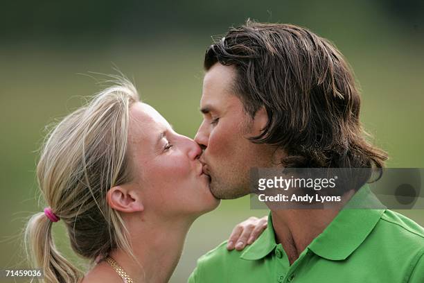 Johan Edfors of Sweden kisses his girfriend Cecilia after his victory after the final round of The Barclays Scottish Open at Loch Lomond Golf Club on...