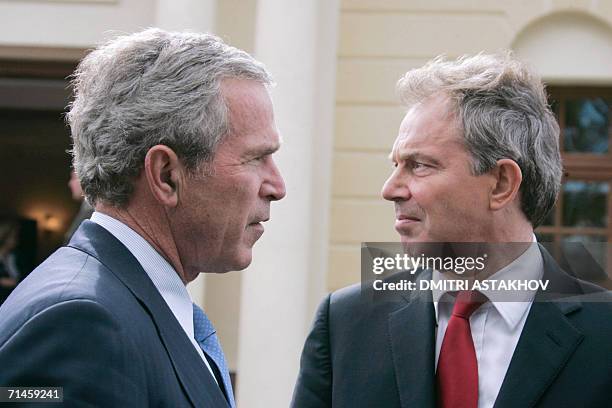 St Petersburg, RUSSIAN FEDERATION: US President George W.Bush stands next to British Prime Minister Tony Blair prior ot attend their second working...