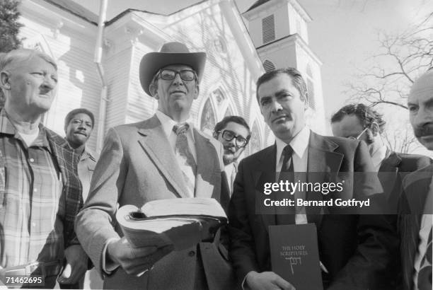 American religious leaders Reverend Bill Bowler and Rabbi Meir Kahane stand with their bibles in their hands outside of a church, Plains, Georgia,...