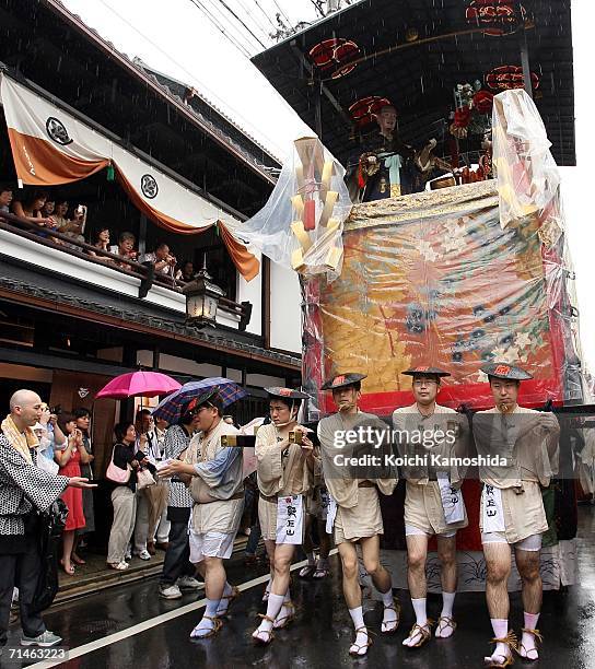 Men pull a hoko float during the Gion Festival July 17, 2006 in Kyoto, Japan. The traditional festival started in 869 AD after a plague spread...