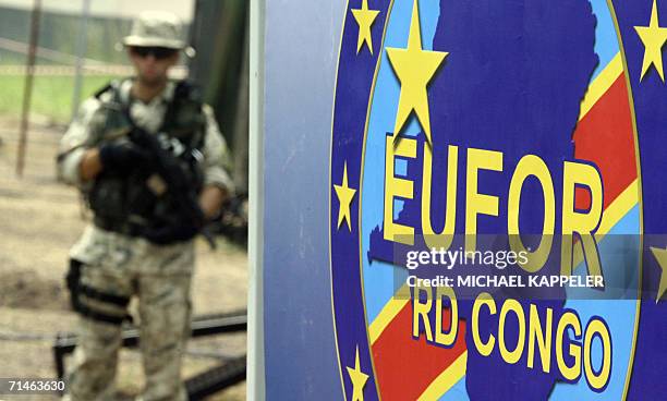 Kinshasa, Democratic Republic of the Congo: A Polish soldier of the EUFOR troops stands behind an EUFOR sign at the N'Dolo camp in Kinshasa, 14 July...