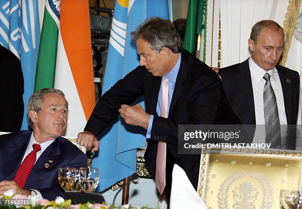 George W.Bush talks to British Prime Minister Tony Blair during a lunch for G8 Leaders, invited leaders and Heads of International Organizations at...