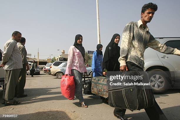 Lebanese citizens arrive to cross into Syria July 17, 2006 at the checkpoint of al Masnaa, Lebanon. Foreigners and Lebanese residents are evacuating...