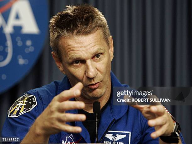 Mission Specialist Piers Sellers of Great Britain answers questions during a press conference after the landing of US space shuttle Discovery 17 July...