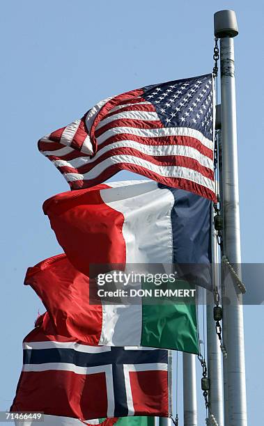 Shirley, UNITED STATES: Flags from countries affected fly over the memorial for TWA Flight 800 on Monday, 17 July 2006 at Smith Point Park in...