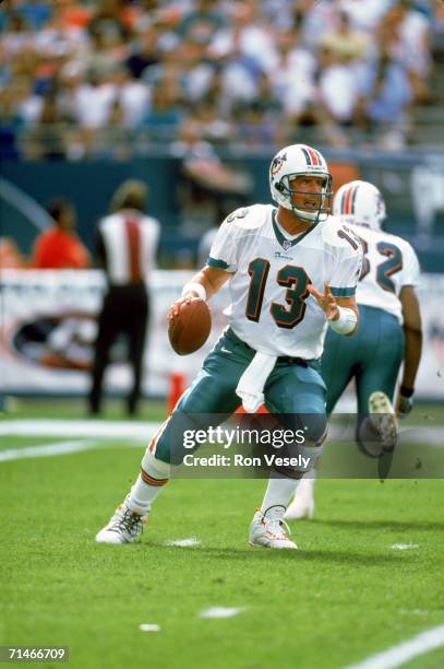 Quarterback Dan Marino of the Miami Dolphins drops back to pass against the Indianapolis Colts at Pro Player Stadium on December 5, 1999 in Miami,...