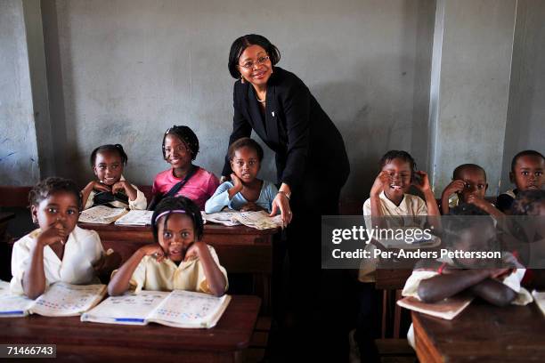 Graca Machel talks to students at 12 Outubro, a primary school in on June 15, 2006 in Maputo, Mozambique. The former first lady is a widow of Samora...