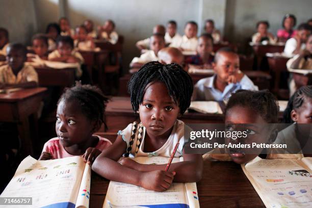 Graca Machel talks to students at 12 Outubro, a primary school in on June 15, 2006 in Maputo, Mozambique. The former first lady is a widow of Samora...