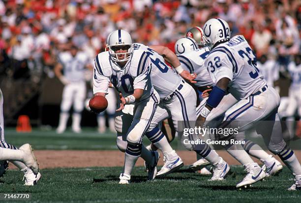 Quarterback Jack Trudeau of the Indianapolis Colts pitches the ball to running back Randy McMillan during a game against the San Francisco 49ers at...