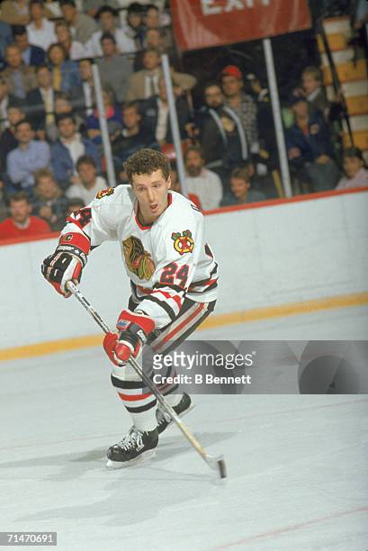 Canadian professional ice hockey player Doug Wilson of the Chicago Blackhawks skates with the puck on the ice during a home game, Chicago, 1980s....