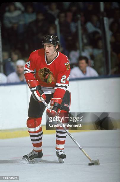 Canadian professional ice hockey player Doug Wilson of the Chicago Blackhawks skates with the puck on the ice during a road game against the New York...