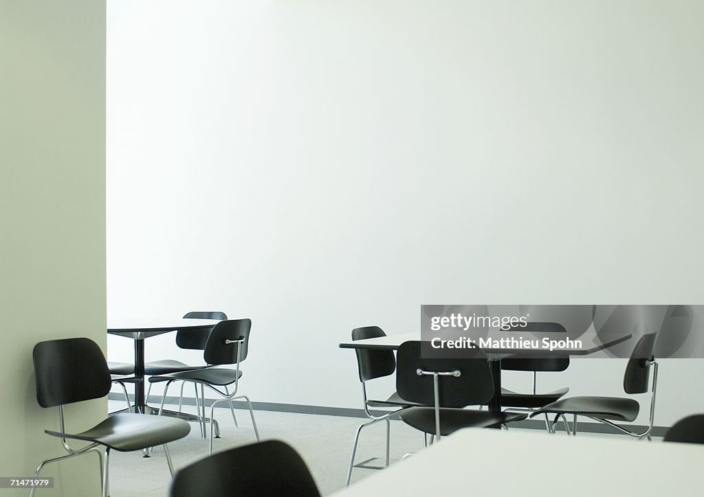 Empty table and chairs in office break room