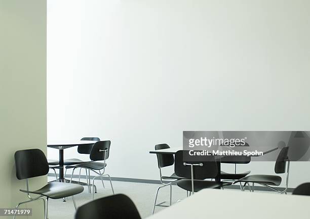 empty table and chairs in office break room - cafeteria stock pictures, royalty-free photos & images