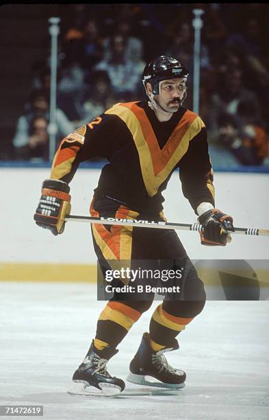 Canadian professional ice hockey player Dave 'Tiger' Williams of the Vancouver Canucks skates on the ice during a game against the New York...