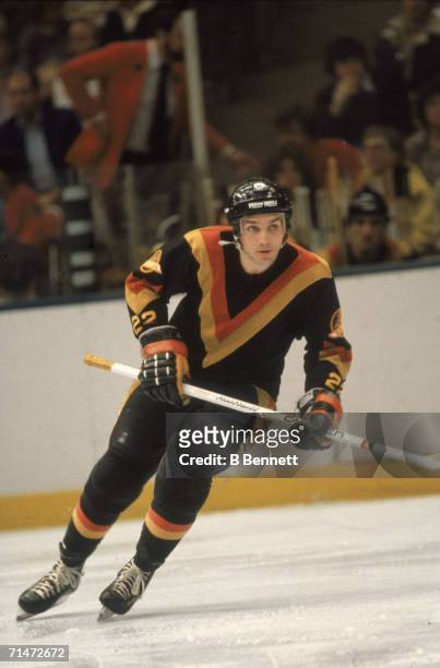 Canadian professional ice hockey player Dave 'Tiger' Williams of the Vancouver Canucks skates on the ice during a game against the New York...