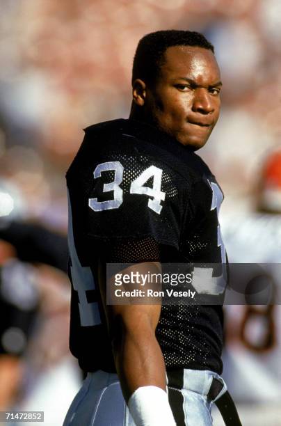 Running back Bo Jackson of the Los Angeles Raiders watches a game at Los Angeles Memorial Coliseum in Los Angeles, California.
