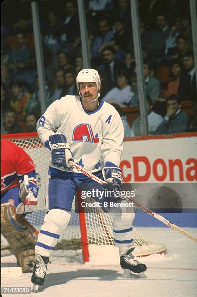 Canadian professional ice hockey player Michel Goulet of the Quebec Nordiques skates on the ice during a home game against the Montreal Canadiens,...