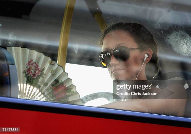 Woman on a bus fans herself to keep cool on July 18, 2006 in London, England. Temperatures soared across Britain on what may turn out to be one of...