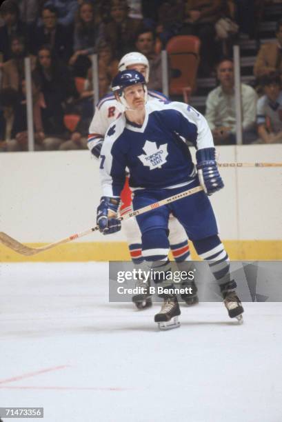 Canadian professional ice hockey player Lanny McDonald of the Toronto Maple Leafs skates on the ice during a game against the New York Rangers,...