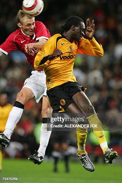 Cape Town, SOUTH AFRICA: Manchester United Defender Danny Simpson tackles Kaizer Chiefs midfielder Arthur Zwane, during the football friendly in Cape...