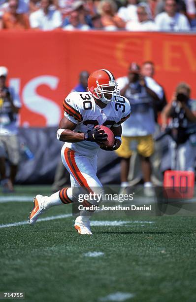 Jamel White of the Cleveland Browns runs with the ball up the field during the game against the Jacksonville Jaguars at Cleveland Stadium in...