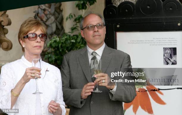 Comedienne Carol Burnett and her husband Brian Miller drink a toast at the dedication ceremony for the Carrie Hamilton Theatre, formerly the Balcony...