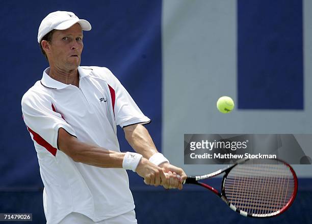 Lars Burgsmuller of Germany returns a shot to Zach Fleishman during the RCA Championships July 18, 2006 at the Indianapolis Tennis Center in...