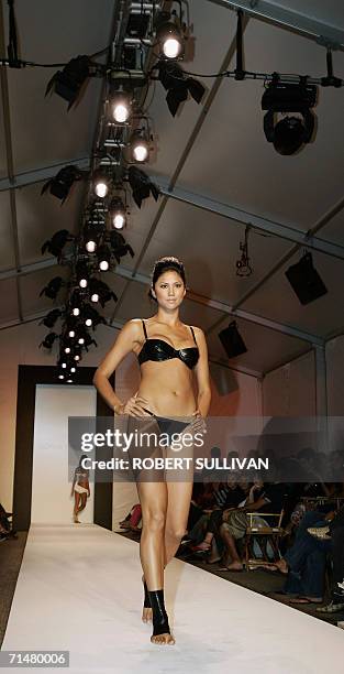 Model wears a design by Norma Kamali 18 July 2006, during the Miami Swim Shows on Miami Beach, FL. AFP PHOTO/Robert SULLIVAN