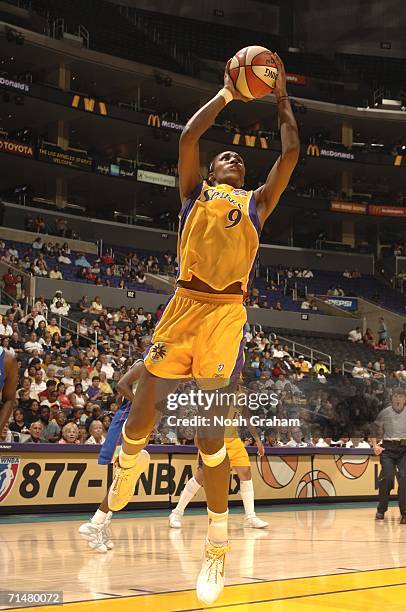 Lisa Leslie of the Los Angeles Sparks goes to the hoop against the New York Liberty on July 18, 2006 at the Staples Center in Los Angeles,...