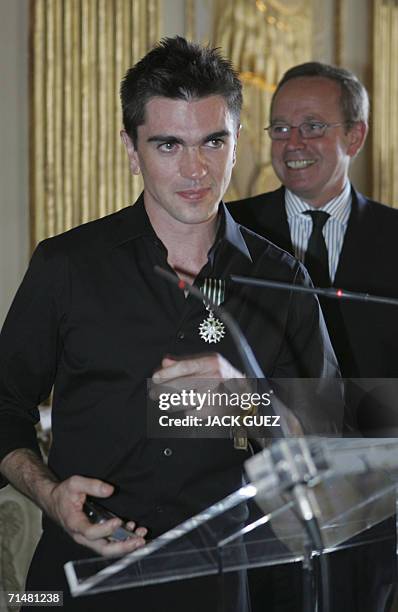 Colombian singer Juanes speaks after receiving the insigna of knight of Arts and Letters from French Minister for Culture and Communications Renaud...