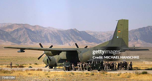 Mazar-i-Sharif, AFGHANISTAN: German soldiers of the NATO-led International Security Assistance Force enter a Transall military plane at the airport...