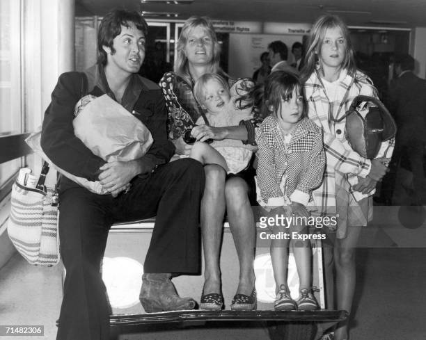 British singer and songwriter Paul McCartney poses with his wife Linda , and their daughters, left to right, Stella, Mary, and Heather, at Heathrow...
