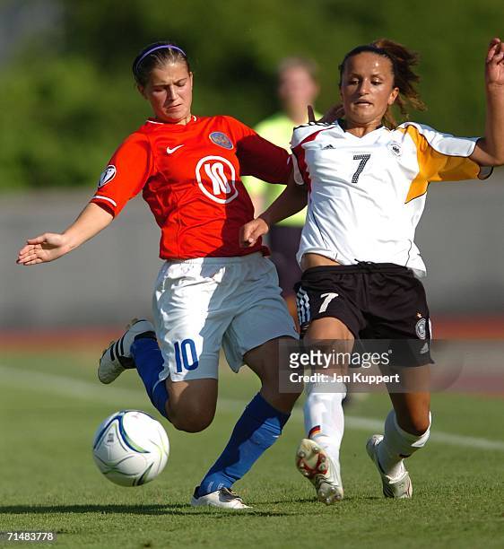 Nadezda Kharchenko of Russia and Fatmire Bajramaj of Germany competes with during the Women's U19 European Championship Semi Final between Germany...