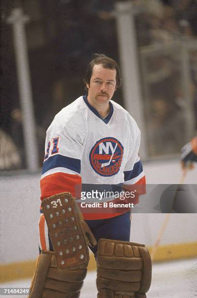Canadian professional ice hockey player Billy Smith, goalie of the New York Islanders, on the ice without his mask during a home game, Nassau...