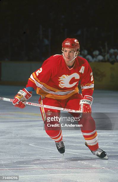Canadian professional ice hockey player Al MacInnis of the Calgary Flames skates on the ice during an away game, 1990s. MacInnis played for the...