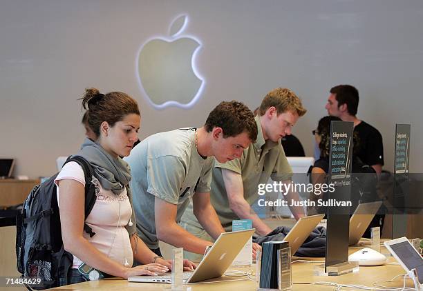 Customers at the Apple Store try out MacBook Pro laptop computers July 19, 2006 in San Francisco, California. Apple Computer Inc. Announced that...